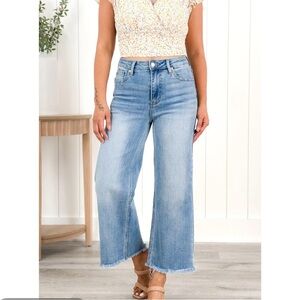 Risen High Rise Medium Wash Wide Legged Cropped Frayed Jeans